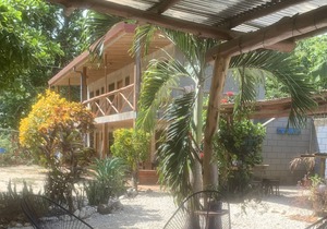 A rustic lodge surrounded by gardens, in a jungle setting - double Room 1