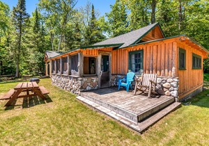All-season lakefront cabin at Scott’s Twin Lake Resort with sunroom, beach, dock