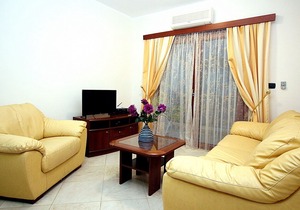 Beach front apartment with side sea view