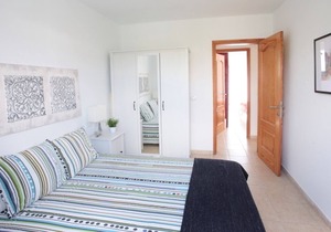 C3, in a small complex with communal heated pool 100m from the sea