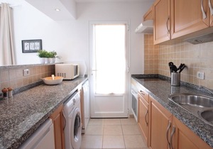 C3, in a small complex with communal heated pool 100m from the sea