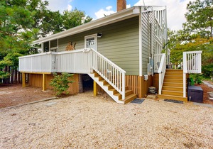 Completely renovated home just steps from beach with charming interior & deck