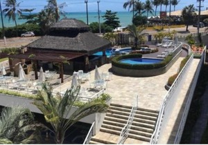 Flat no Blue Marlin Resort Com linda vista do jardim por Carpediem