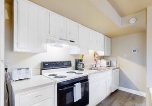 Golf course front home with wood-burning fireplace, deck & paid pool access