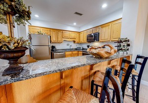 Lakefront condo with wood-burning fireplace, WiFi, two decks, & great views