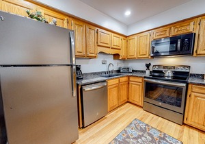 Lakefront condo with wood-burning fireplace, WiFi, two decks, & great views