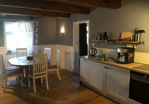Living in the mill building, surrounded by green meadows.
