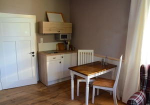 Living in the mill building, surrounded by green meadows.