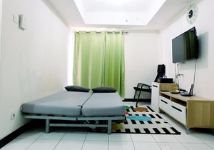 Minimalist 1BR with City View The Wave Apartment By Travelio