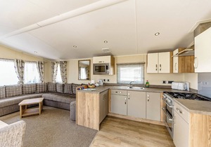 Modern and contemporary 12ft-wide caravan with one double and one twin.