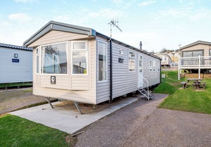 Modern and spacious 12ft-wide caravan with one double and two twin.
