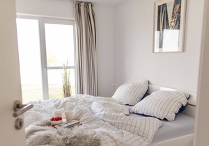 Modern ground floor apartment with direct water view, terrace and WiFi