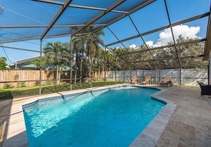 Naples Park Paradise with salt water heated pool.