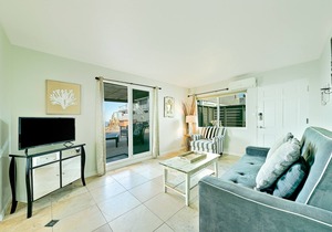 Ocean-view cottage with deck, grills, WiFi & private patio