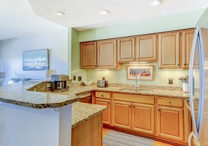 Penthouse living at Shelter Cove Marina with balcony, harbor view, pool & tennis