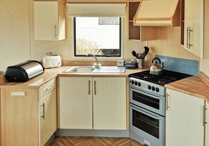 Spacious and comfortable 12ft-wide caravan with one double and two twin.