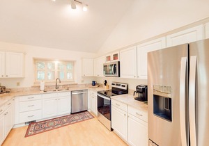 Spacious family retreat w/water view, large deck, & perfect location