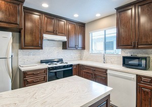 Spacious upper rear unit in an oceanfront triplex just steps from the Balboa Pier fun!