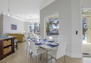 SW exposure home on wide canal with pool and spa
