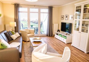 Terrasse, gratis Nutzung vom AHOI Erlebnisbad und Sauna in Sellin - Meeresblick FeWo 12