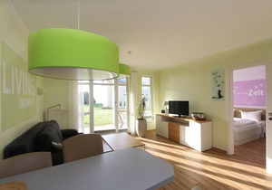Terrasse, gratis Nutzung vom AHOI Erlebnisbad und Sauna in Sellin - Meeresblick FeWo 31