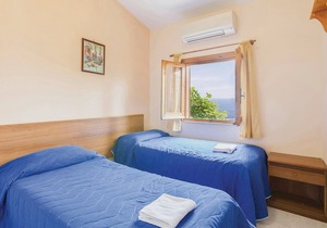 This modern bungalow belongs to a vacation home complex directly above the sea, with a unique panora