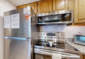 Updated ocean-view condo with beach access, patio, central AC & washer/dryer