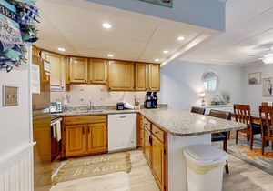 Updated ocean-view condo with beach access, patio, central AC & washer/dryer