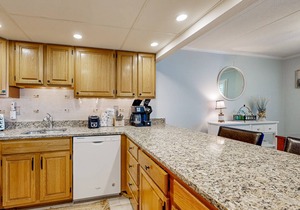 Updated ocean-view condo with beach access, patio, central AC & washer/dryer