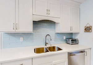 Updated, waterfront condo with amazing lagoon & golf views from the sunroom