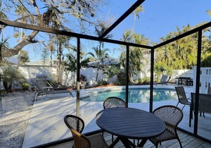 Walk to the Beach and More from this Fully Renovated Unit W/Heated Pool