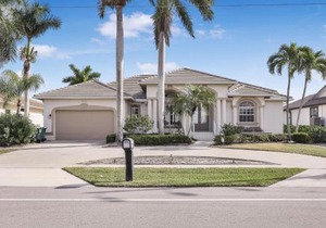 Waterfront home with views, pool and walk to beach