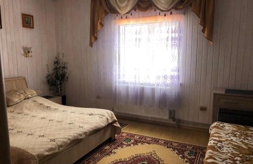 Podobovets House | Біля комори