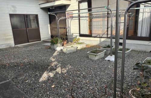 Hoshinooka House | 木の家ゲストハウス松山本館