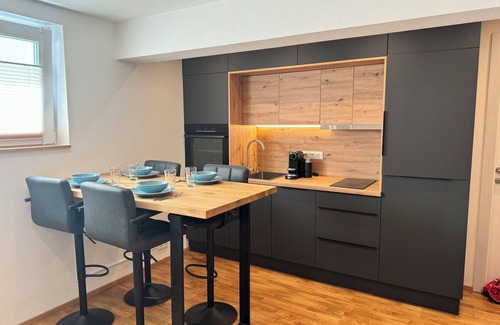 Flintsbach A. Inn Apartment | 1,5-room, top equipped, 4 pers., basement, parking lot, self check-in