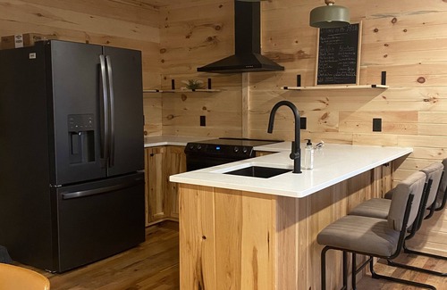 Amery Cabin | 1 Bdr Cabin unit Respite on Apple River. Kayaks, SUPs, and more! Pet friendly!