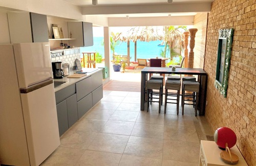 Grand Case Apartment | 1 or 2 bedrooms Beach Front Property with Private Garden overlooking the beach