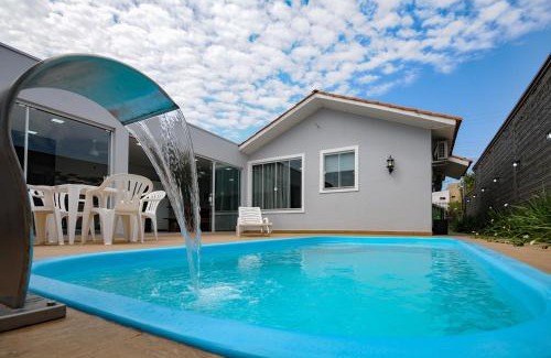 Foz do Iguacu House | 10 hóspedes - PISCINA água salgada - Cozinha GOURMET - 4 quartos - 3 banheiros - 2,1 km do Cataratas JL Shopping