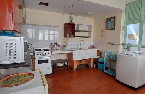Miraflores House | 10 minutes walking from Kennedy park. Access to a kitchen and a terrace.