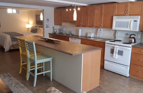 Barrie Apartment | 10% Off Flash Sale! Cozy & Bright Suite: Heated Floors, Fireplace, and Backyard!