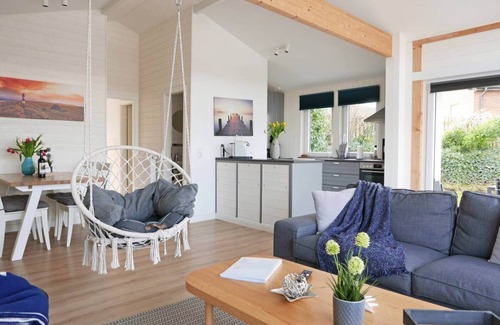 Ruckeberg House | 100m away from the beautiful Schlei, you will find our extensively renovated and modern bungalow "Schlei-Idyll" with maritime details, as well as a small garden area with terrace for your well-deserved time out