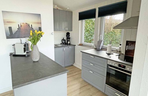 Ruckeberg House | 100m away from the beautiful Schlei, you will find our extensively renovated and modern bungalow "Schlei-Idyll" with maritime details, as well as a small garden area with terrace for your well-deserved time out