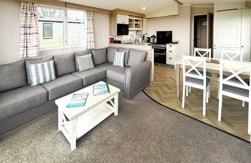 Castle Douglas House | 12ft-wide caravan situated in a coastal position.