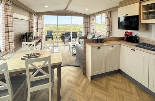 Castle Douglas House | 12ft-wide caravan situated in a coastal position.