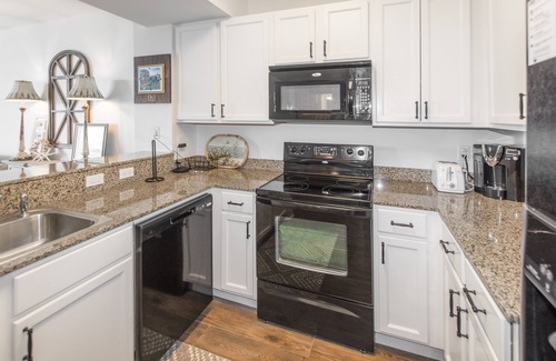 Indian Bayou Condo | 1411 | Walk to Morgans! Tropical Pools & Amenities Galore!