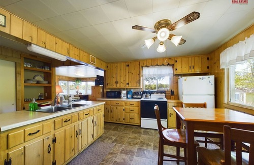 Munising Cabin | 16 Mile Lake Getaway-Lakefront with Water Toys & Family Time Around a Fire