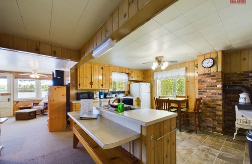 Munising Cabin | 16 Mile Lake Getaway-Lakefront with Water Toys & Family Time Around a Fire