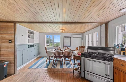 North House | 1899 Old Log Cabin School House w/10 acres on the Chesapeake Bay with Beach
