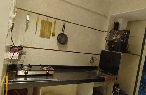 Kharghar Apartment | 1BHK flat fully furnished bedroom, hallway with single bed balconies.