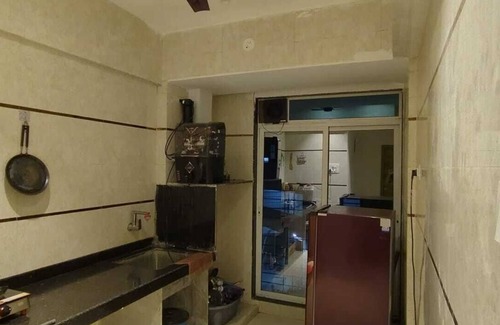 Kharghar Apartment | 1BHK flat fully furnished bedroom, hallway with single bed balconies.